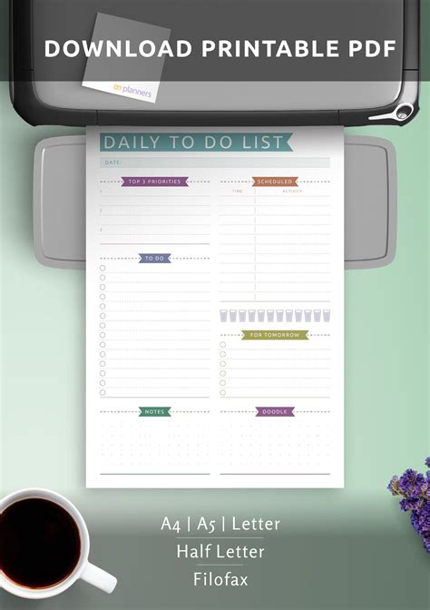 the printable daily planner is on top of a desk next to a cup of coffee