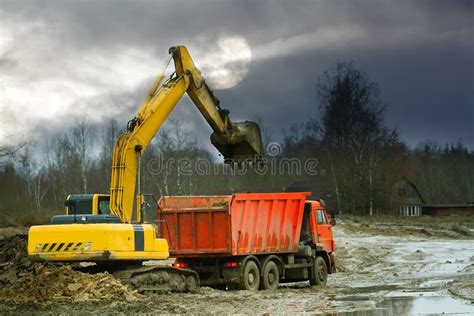 Excavator Loads Excess Soil Into Dump Trucks Stock Photo Image Of