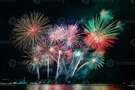 Amazing Beautiful Colorful Fireworks Display On Celebration Night Showing On The Sea Beach With