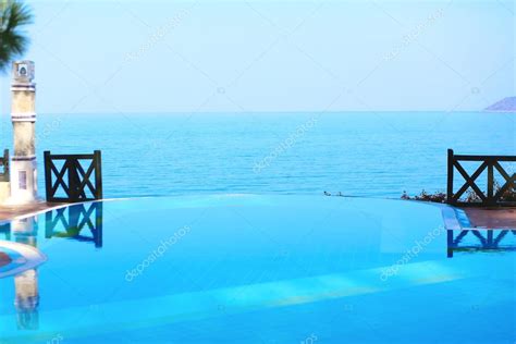 Infinity pool in luxury hotel — Stock Photo © CroMary #73982251