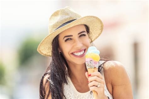 Premium Photo Beautiful Happy Woman Licks Ice Cream During A Hot Summer Day