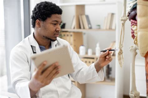 Specialist Holding Tablet and Indicating Carpus Bones at Model Stock Image - Image of physician ...