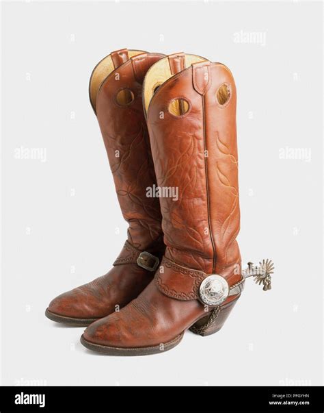 Pair of cowboy boots with spurs Stock Photo - Alamy