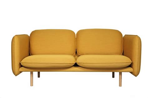 Two Yellow Couches Sitting Next To Each Other