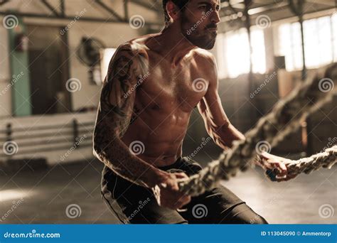 Powerful Man Exercising With Battle Ropes At Gym Stock Photo Image Of