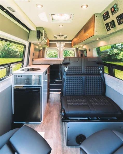 The Interior Of An Rv With Black Leather Seats