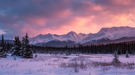 Sunset In Mountains Purple Sky Over Snow Capped Mountains Winter