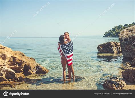 American Flag In Water With Sexy Woman And Man Independence Day