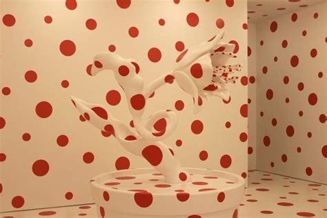 A Room With Red And White Polka Dots On The Walls An Abstract