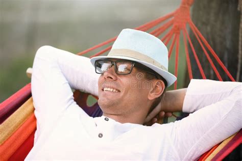 Man Resting In Comfortable Hammock At Green Garden Stock Image Image