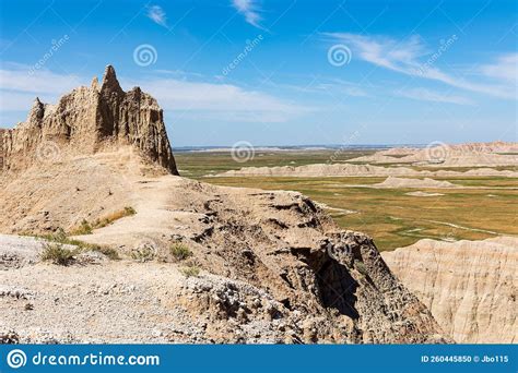 Spires And Mountain Ranges Rising From The Plain Badlands National