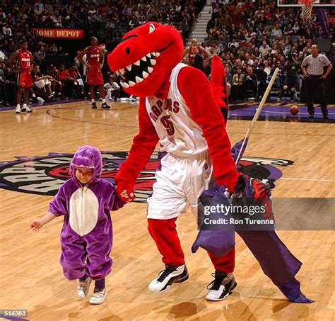 dinosaur mascot stock  high res pictures  images getty