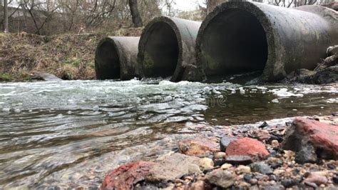 Streams Of Water Flow Through Concrete Sewers Polluted Body Of Water In The Park Stock Footage