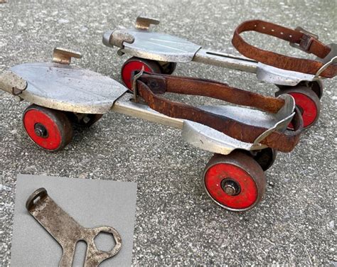 Vintage Metal Adjustable Roller Skates And Key Winchester Model 50