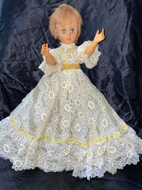 18 Blonde Hair Blue Eyes Fashion Doll Wearing Long Dress With Daisies All Over And White High