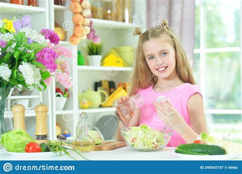 Portrait Of Cute Girl Preparing Delicious Fresh Salad Stock Image