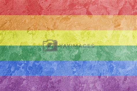 Rainbow LGBTQ Or Gay Pride Flag On Decorative Plaster Or Concrete Texture Abstract Background