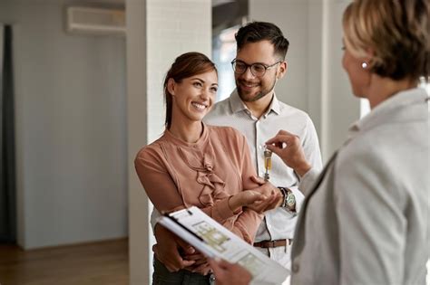 Premium Photo Happy Couple Buying New Home And Receiving House Keys