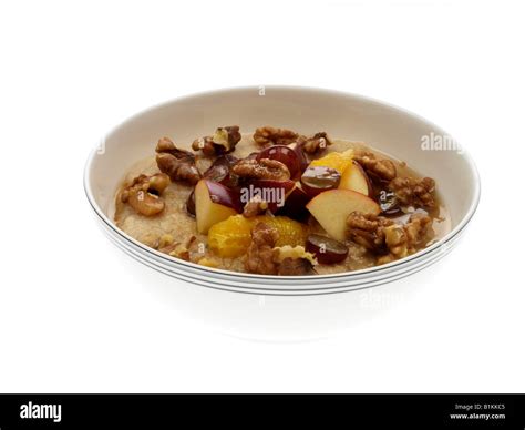 Oatmeal with Fruit and Nuts Stock Photo - Alamy