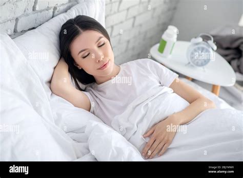 Pretty Brunette Sleeping In Bed Hi Res Stock Photography And Images Alamy