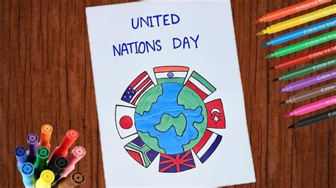 a child's hand with crayons and markers next to a poster that says united nations day