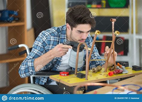 Manual Worker In Wheelchair Welding Cooper Pipes Stock Image Image Of