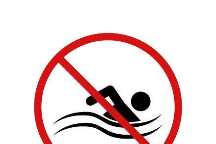 A Sign With A Person Swimming In The Water And No Swimming Allowed To