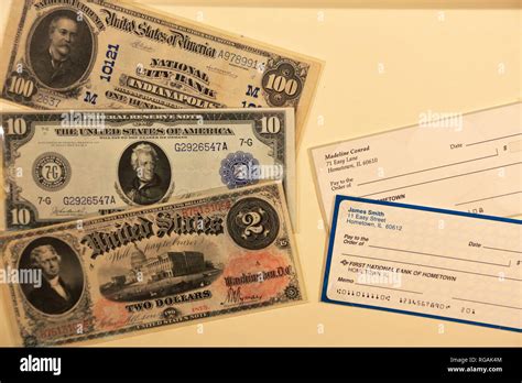 Historical US paper currency and checks display at Money Museum in Federal Reserve Bank of ...