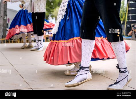 Spanish people wearing traditional clothes dancing Stock Photo - Alamy