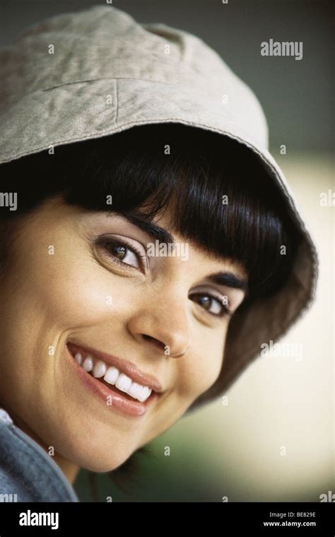 Woman wearing hat, smiling, portrait Stock Photo - Alamy