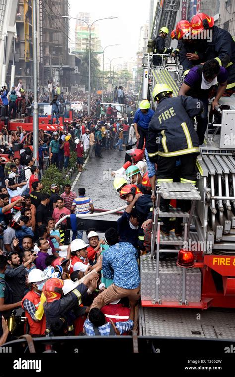 Bangladeshi Firefighters Rescue People From A Burnt Office Building In