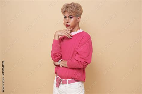 Youth Asian Transgender Lgbt Looking At Camera While Posing Isolated Over Nude Color Background