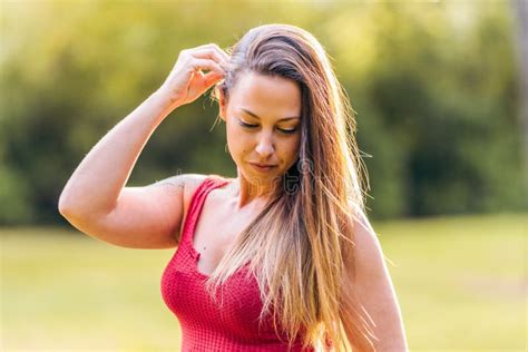 Blonde Woman Touching Her Hair In A Park Stock Photo Image Of Model Hispanic 223409514