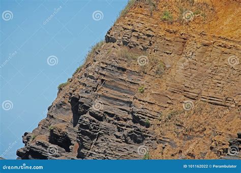 ROCK with STRATUM LAYERS at the COAST Stock Photo - Image of grass ...