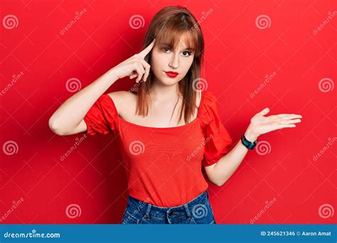 Redhead Young Woman Wearing Casual Red T Shirt Confused And Annoyed