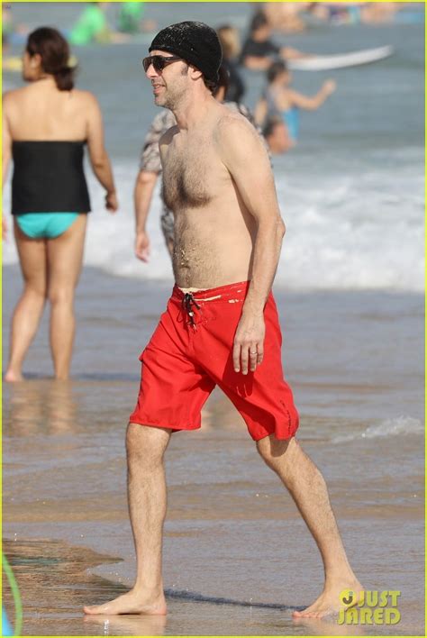 Isla Fisher Buries Sacha Baron Cohen In Sand At The Beach Photo