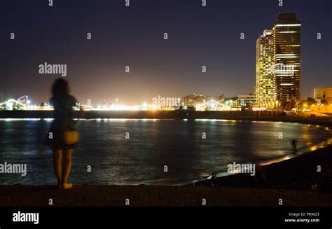 Landscape of illuminated Barceloneta Beach in summer night in Barcelona ...