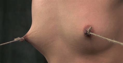 Ruined Brunette Doxy Gets Her Nipples Tied To Her Feet Under Pressure