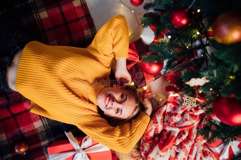 Beautiful Blonde Lying By The Christmas Tree On New Year X S Eve Christmas Stock Photo