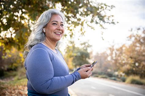 Beautiful Woman With Smartphone Getting Ready For Workout Stock Photo ...
