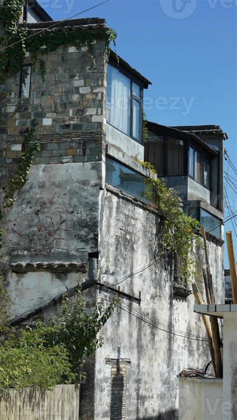 The beautiful traditional Chinese village view with the classical architecture and fresh green ...