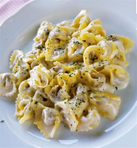 Homemade Tortellini Filled With Ricotta In Cheese Sauce Homemade Tortellini Food Tortellini