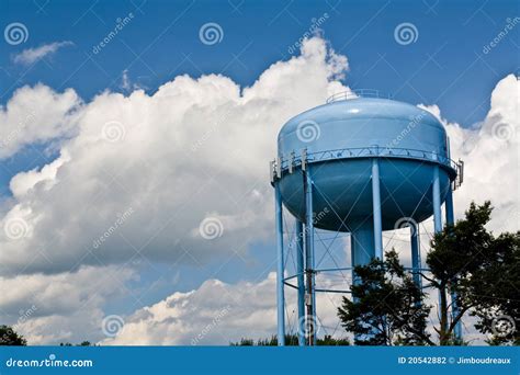 Blue Water Tower Under Cloudy Skies Stock Photo Image Of Landscape