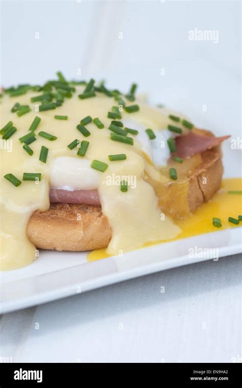 Eggs Benedict Toasted English Muffins Ham Poached Eggs And Delicious Buttery Hollandaise Sauce