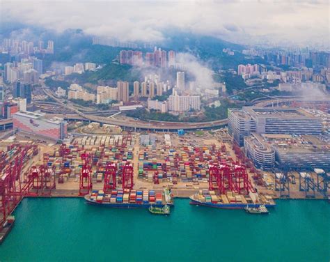 Premium Photo High Angle View Of Commercial Dock By Sea Against Sky