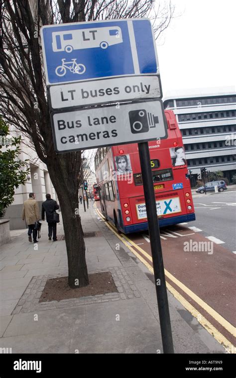 LT Bus only sign and Bus Lane cameras sign with moving bus in the City ...