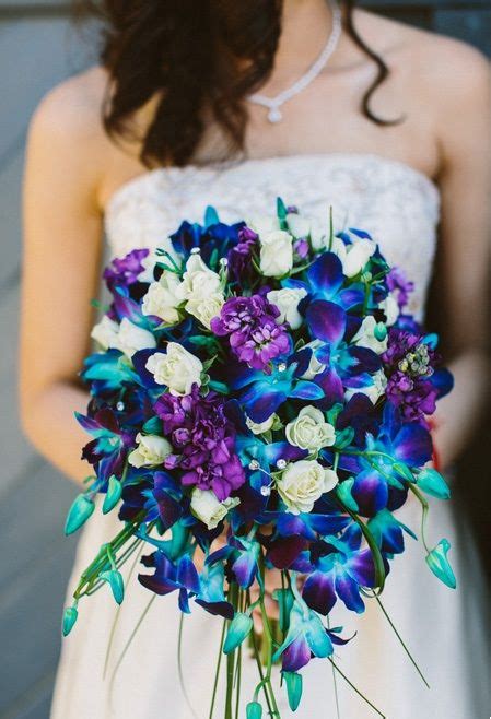 Love this! Blue dendrobium orchid in the bouquet. | Blue orchid wedding ...