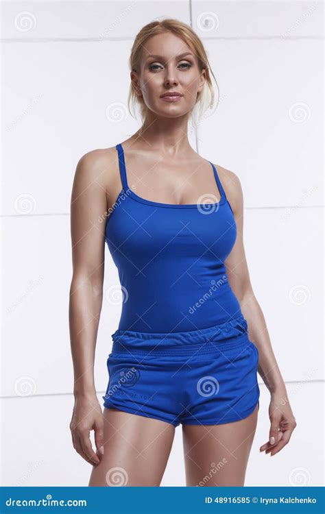 Beautiful Sexy Blonde With Perfect Athletic Slim Figure Engaged In Yoga Exercise Or Fitness