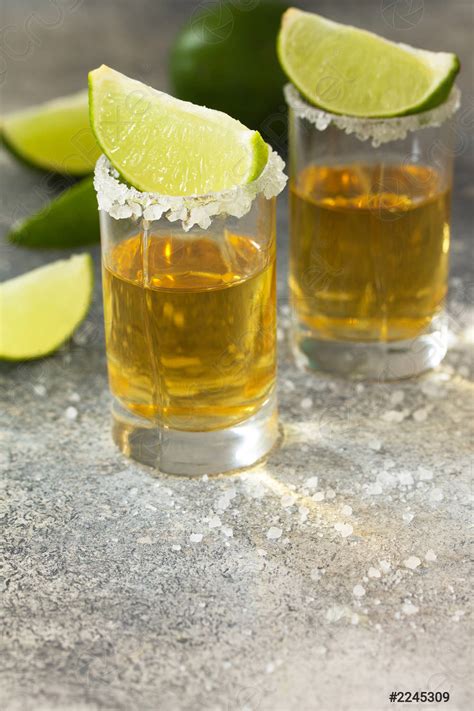 Gold Tequila Mexican Gold Tequila shot with lime and salt - stock photo ...