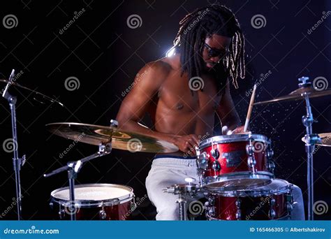 Young Black Male Hitting Perform Rock Music Using Drum Set Stock Image